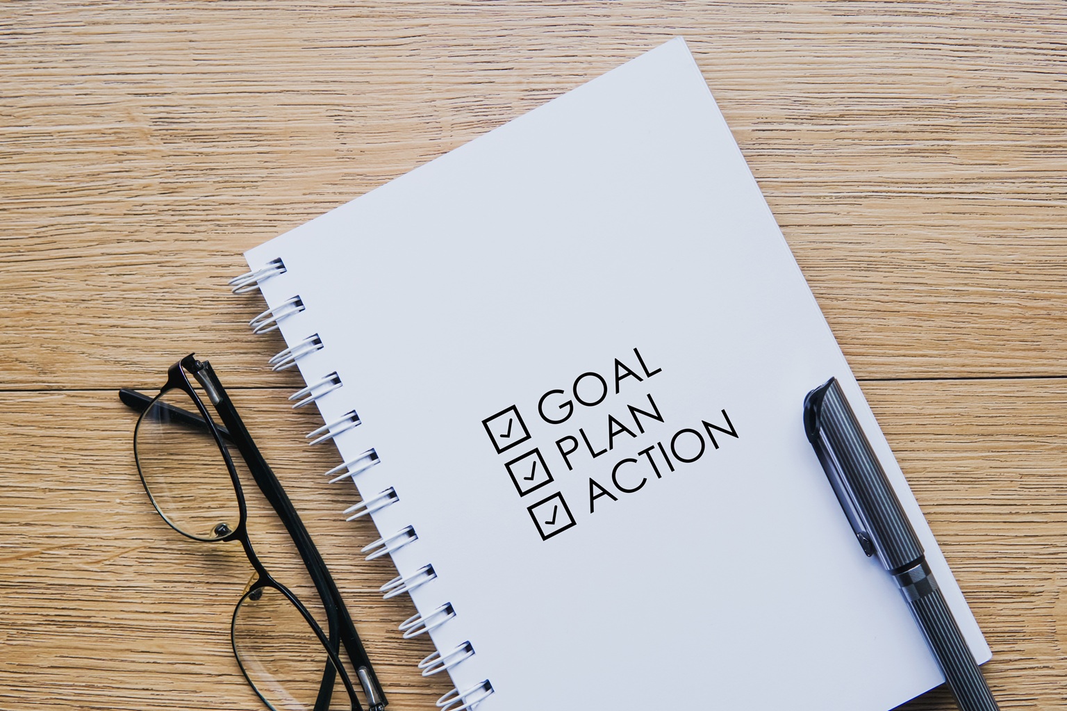 Blocco note con scritta Goal, Plan, Action